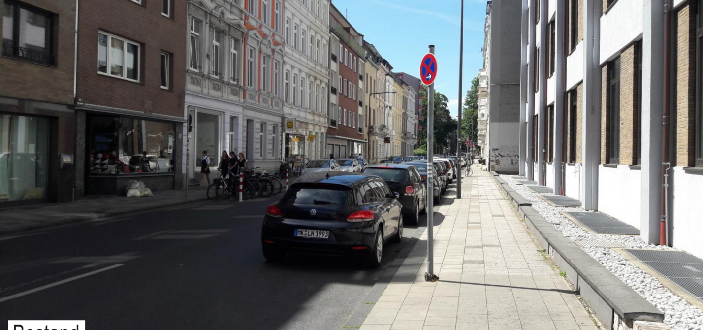 Der Status Quo der Lochnerstraße. Beidseitig sind Kfz geparkt, wodurch nur wenig freie Fahrbahnbreite bleibt.